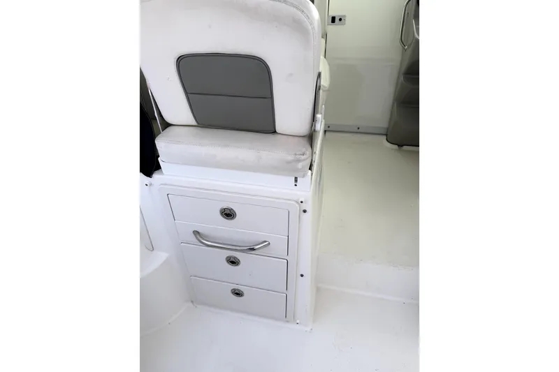 Slide: The Image of Interior of 2014 Boston Whaler 285 Conquest showing seat and storage drawers. - 12