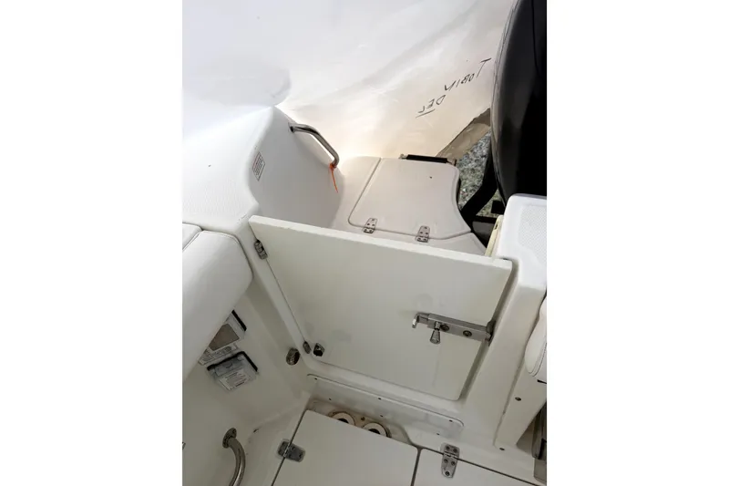 Slide: The Image of 2014 Boston Whaler 285 Conquest boat interior with storage compartments. - 14