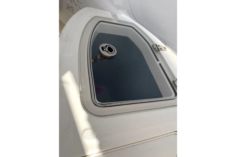 Slide: The Image of Hatch on 2014 Boston Whaler 285 Conquest boat, featuring a secure lock mechanism. - 16