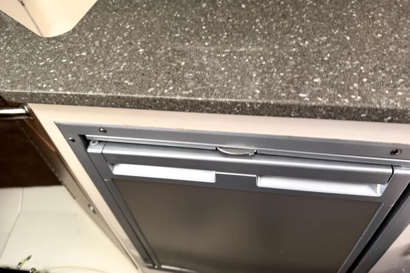 Slide: The Image of 2014 Boston Whaler 285 Conquest interior with sleek countertop and built-in appliance. - 20