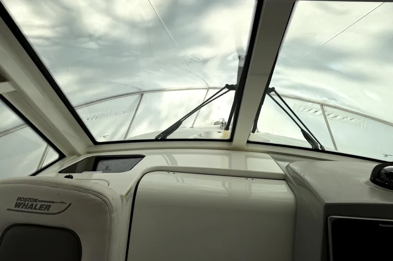 Slide: The Image of Interior view of 2014 Boston Whaler 285 Conquest boat with windshield and dashboard. - 4