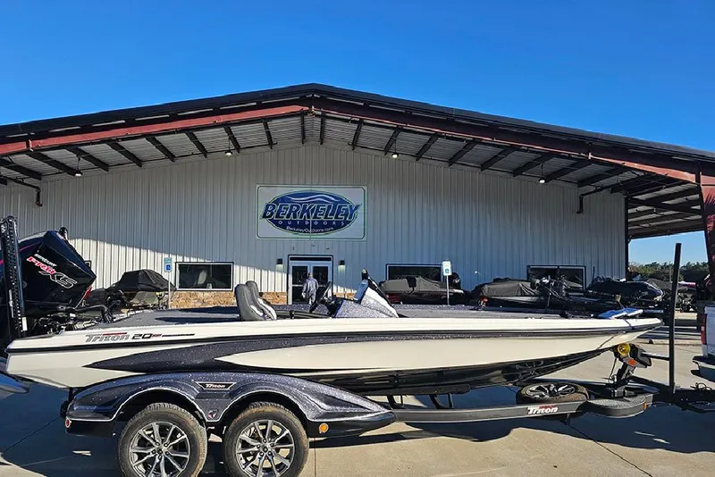 The Image of 2026 Triton 20XP Patriot boat displayed at Berkeley Outdoors dealership. - 0