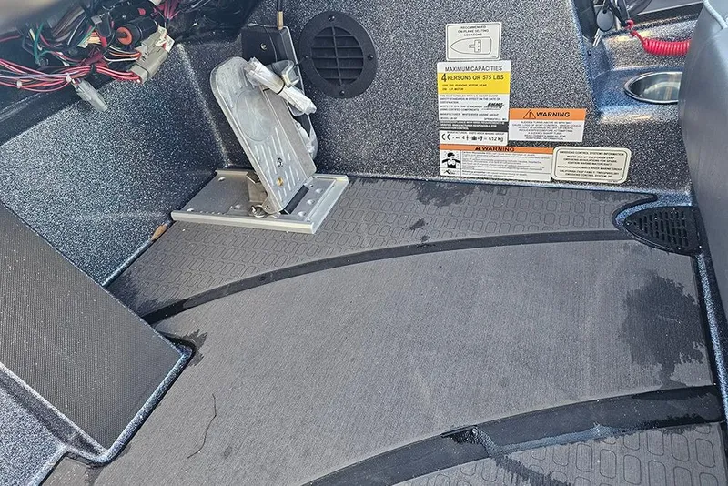 Slide: The Image of 2026 Triton 20XP Patriot boat cockpit with Lowrance display and steering wheel. - 14