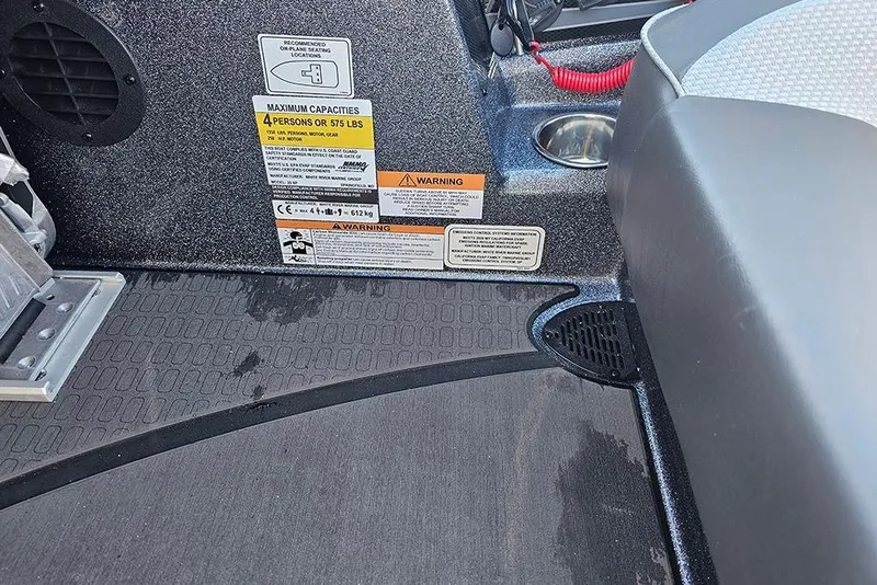 Slide: The Image of 2026 Triton 20XP Patriot boat storage compartments with secure locking system. - 16