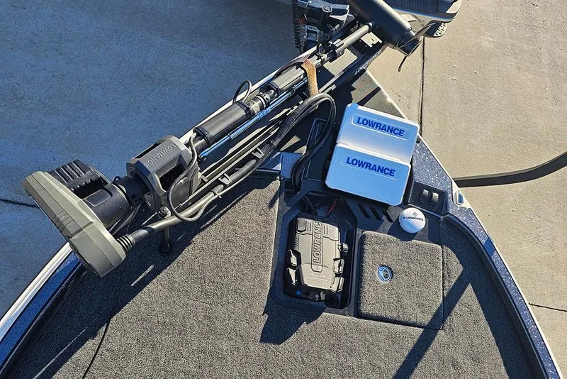 Slide: The Image of Triton 20XP Patriot 2026 boat with Lowrance electronics and trolling motor on deck. - 20