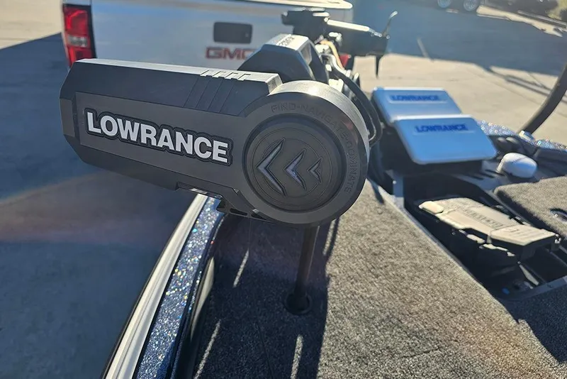 Slide: The Image of 2026 Triton 20XP Patriot boat with Lowrance electronics on deck. - 21