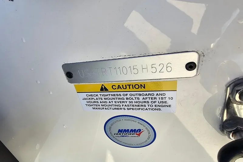 Slide: The Image of Hull identification number on 2026 Triton 20XP Patriot boat with caution label. - 23
