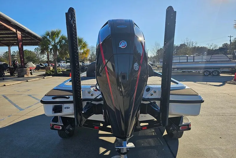 Slide: The Image of 2026 Triton 20XP Patriot boat with Mercury Pro XS engine, featuring spacious deck storage. - 8