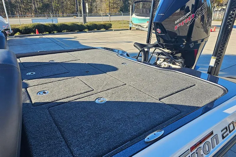 Slide: The Image of 2026 Triton 20XP Patriot boat battery compartment with wiring and components. - 9