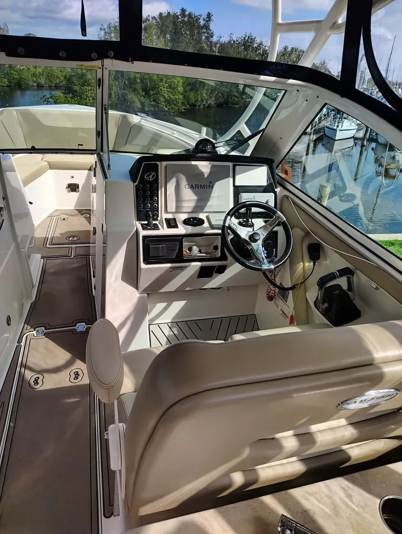 Slide: The Image of Interior of 2017 Sailfish 325 Dual Console with helm station. - 2