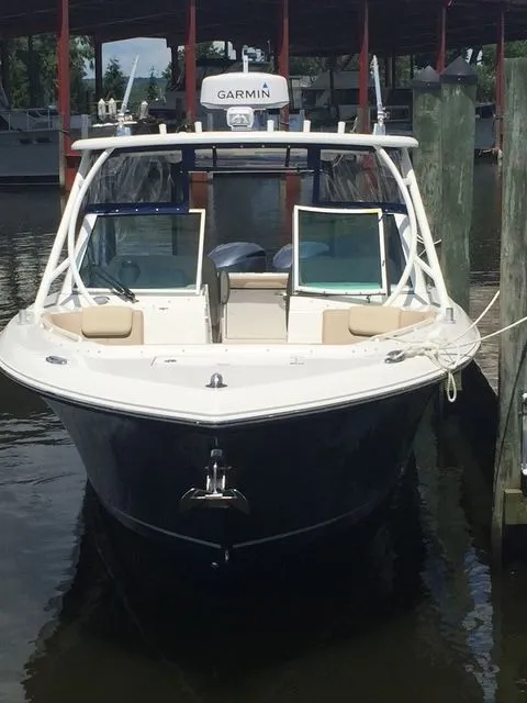 Slide: The Image of 2017 Sailfish 325 Dual Console boat docked at marina. - 3