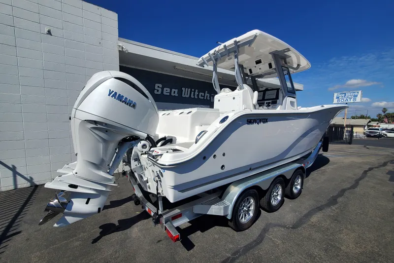 Slide: The Image of 2026 Sea Fox 288 Commander boat with Yamaha engine on a trailer. - 1