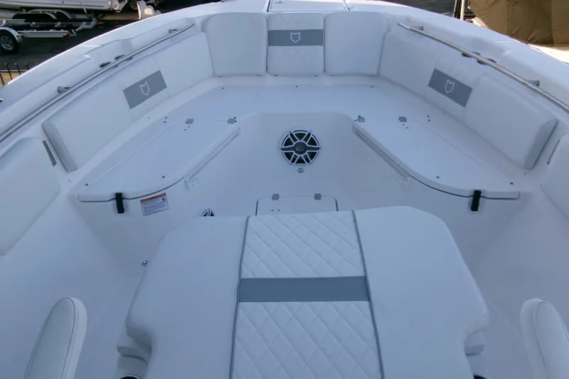 Slide: The Image of 2026 Sea Fox 288 Commander boat interior with white seating and storage compartments. - 11