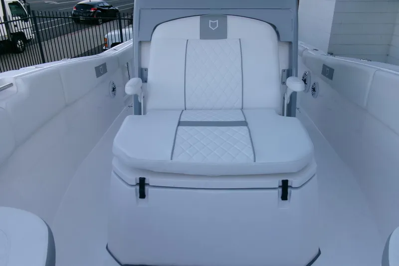 Slide: The Image of 2026 Sea Fox 288 Commander boat interior with white cushioned seating. - 14