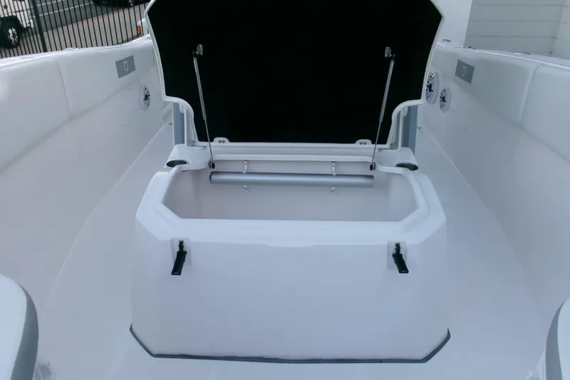 Slide: The Image of 2026 Sea Fox 288 Commander boat storage compartment open, showcasing spacious interior. - 15