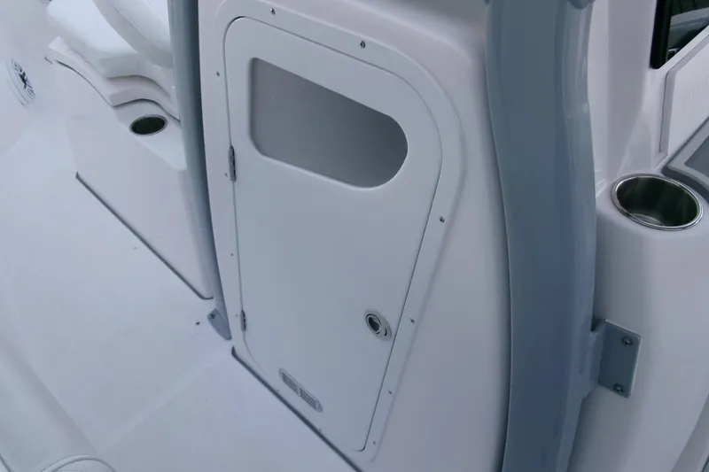 Slide: The Image of 2026 Sea Fox 288 Commander boat interior with storage compartment and cup holder. - 18