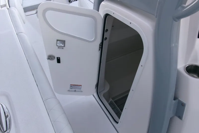 Slide: The Image of 2026 Sea Fox 288 Commander boat interior storage compartment with open door. - 19
