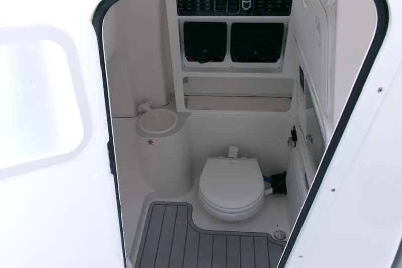 Slide: The Image of 2026 Sea Fox 288 Commander boat interior with toilet and storage compartments. - 20