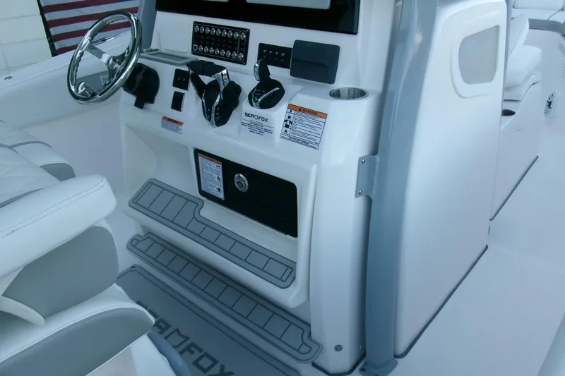 Slide: The Image of 2026 Sea Fox 288 Commander boat console with steering wheel and controls. - 22