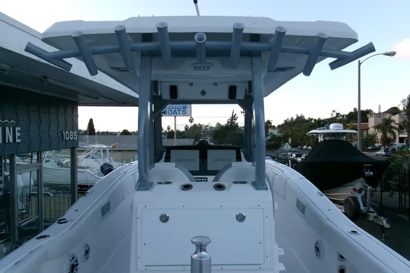 Slide: The Image of 2026 Sea Fox 288 Commander boat with T-top and Garmin electronics at a marina. - 28