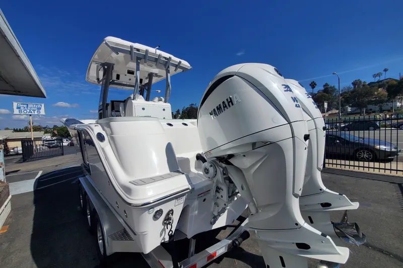 Slide: The Image of 2026 Sea Fox 288 Commander boat with Yamaha engines, parked at a marine dealership. - 3