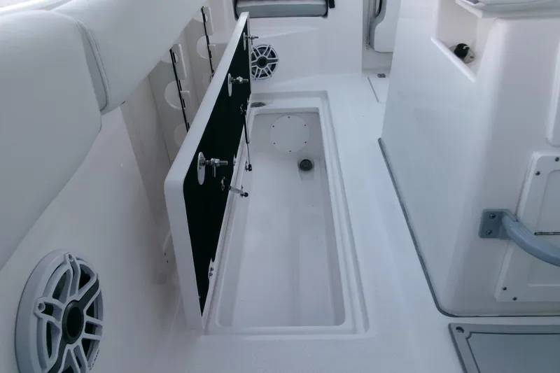 Slide: The Image of 2026 Sea Fox 288 Commander interior with storage compartment and speaker. - 34