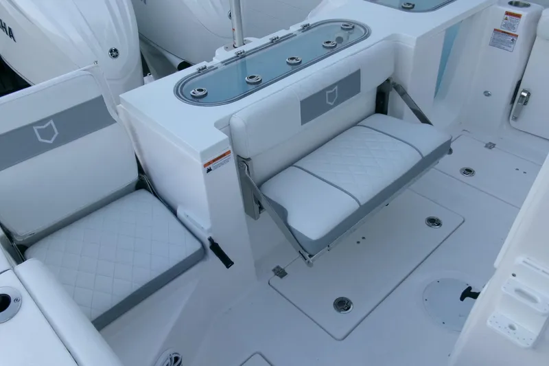 Slide: The Image of 2026 Sea Fox 288 Commander boat interior with cushioned seating and storage compartments. - 40