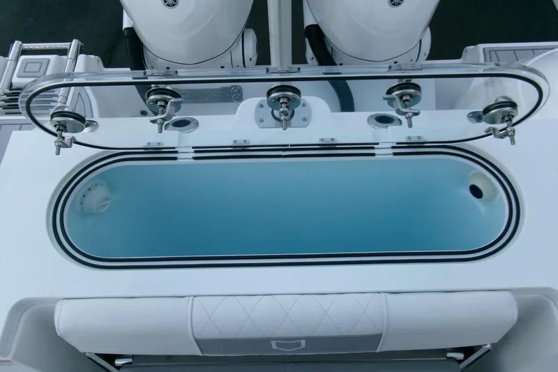 Slide: The Image of 2026 Sea Fox 288 Commander livewell with rod holders and dual outboard engines. - 41