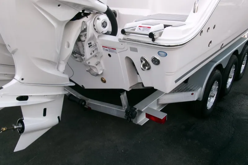 Slide: The Image of 2026 Sea Fox 288 Commander boat on trailer, showcasing engine and hull details. - 45