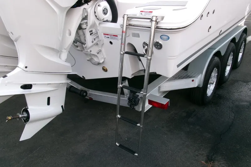 Slide: The Image of 2026 Sea Fox 288 Commander boat with ladder and triple-axle trailer. - 46