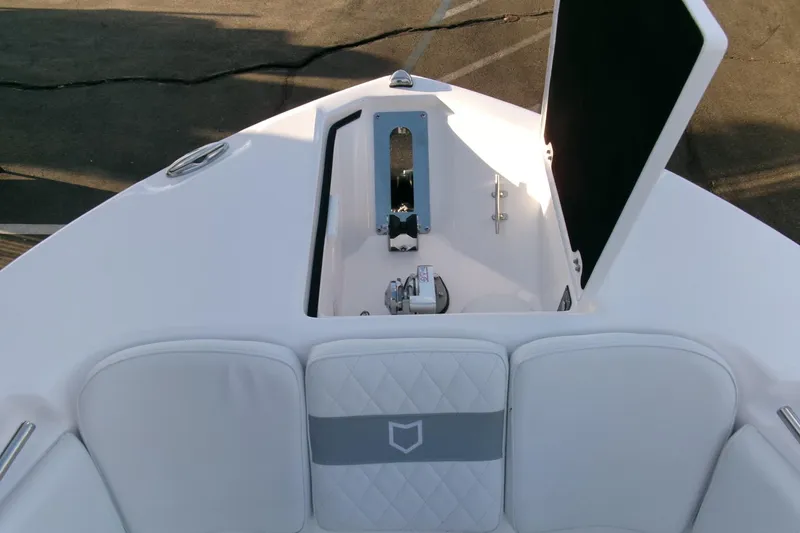 Slide: The Image of 2026 Sea Fox 288 Commander boat bow with anchor compartment open. - 5