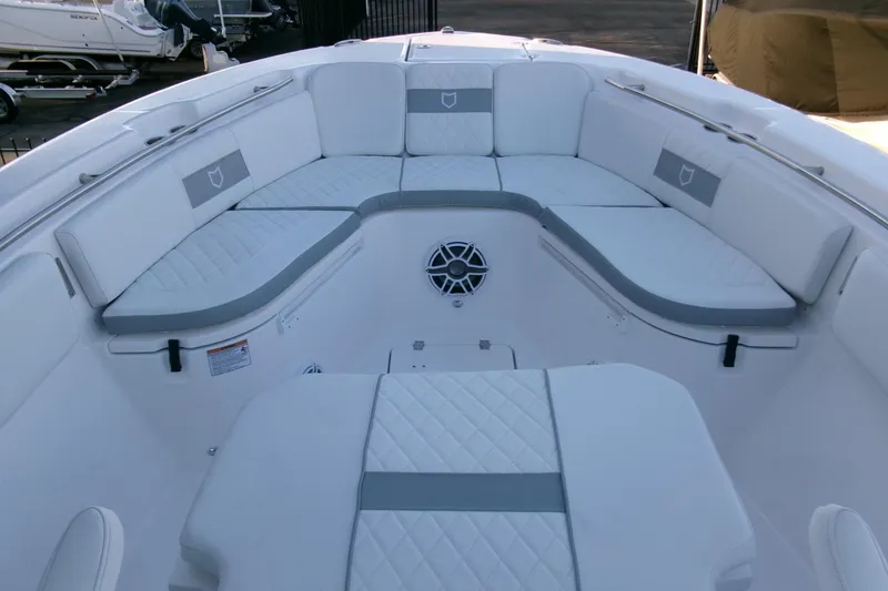 Slide: The Image of Luxurious seating area on 2026 Sea Fox 288 Commander boat, featuring white and gray upholstery. - 6