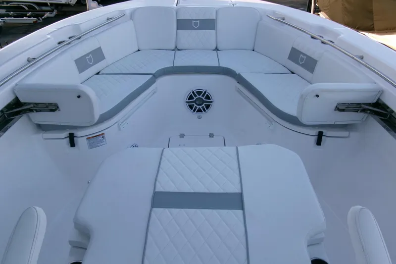 Slide: The Image of 2026 Sea Fox 288 Commander boat interior with white cushioned seating. - 7