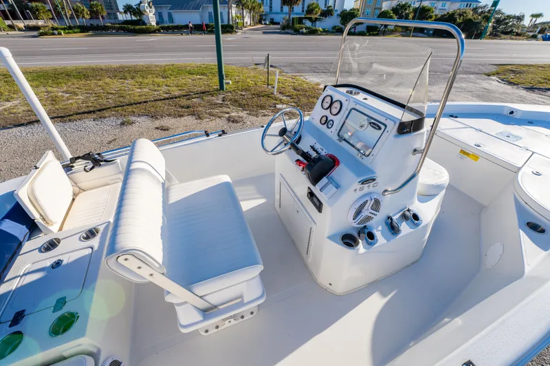 Slide: The Image of 2011 NauticStar 1910 NauticBay boat interior with seating and steering console. - 12