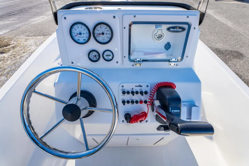 Slide: The Image of 2011 NauticStar 1910 NauticBay boat interior with control panel and speaker. - 15