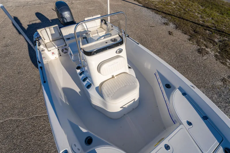 Slide: The Image of 2011 NauticStar 1910 NauticBay boat with seating, parked outdoors. - 21