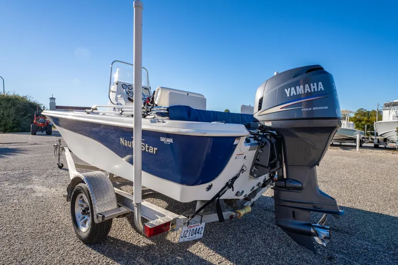Slide: The Image of 2011 NauticStar 1910 NauticBay boat with Yamaha engine on trailer. - 31