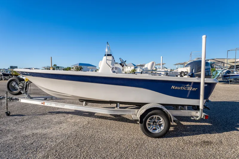 Slide: The Image of 2011 NauticStar 1910 NauticBay boat on trailer under clear blue sky. - 32