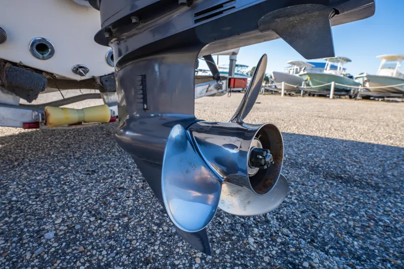 Slide: The Image of 2011 NauticStar 1910 NauticBay with Yamaha four-stroke outboard engine, docked outdoors. - 5