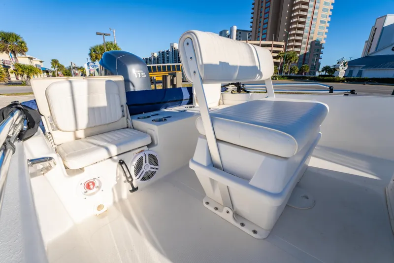 Slide: The Image of Close-up of 2011 NauticStar 1910 NauticBay boat propeller on gravel surface. - 6