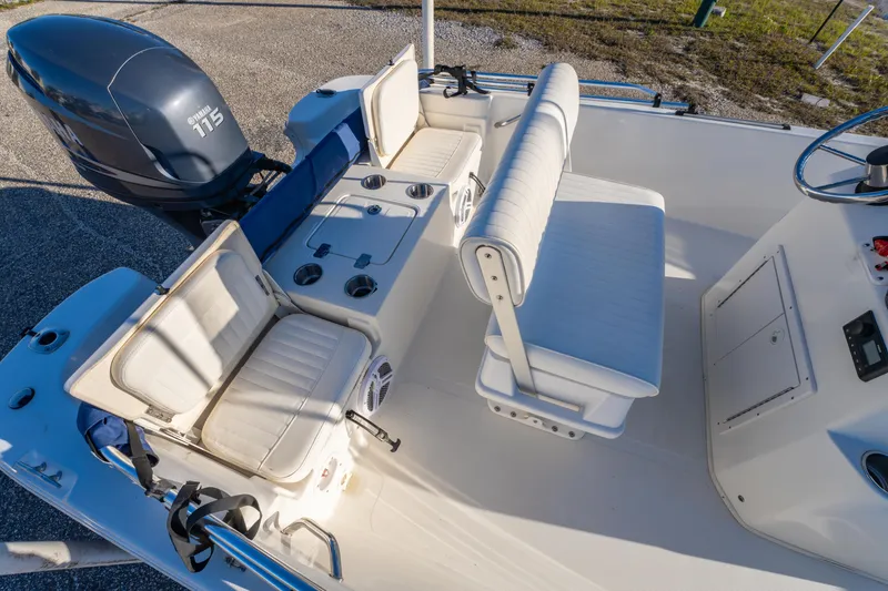 Slide: The Image of 2011 NauticStar 1910 NauticBay boat interior with seating and Yamaha 115 engine. - 7