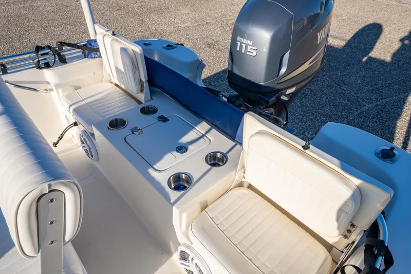 Slide: The Image of 2011 NauticStar 1910 NauticBay boat interior with seating and Yamaha 115 engine. - 9