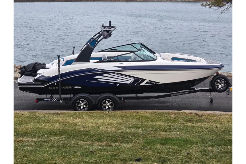The Image of 2016 Chaparral Vortex 243 VRX boat on trailer by a lake. - 0