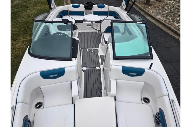 Slide: The Image of 2016 Chaparral Vortex 243 VRX boat interior with white and blue seating. - 21