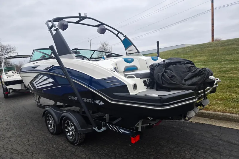 Slide: The Image of 2016 Chaparral Vortex 243 VRX boat on trailer, parked on a paved road. - 3