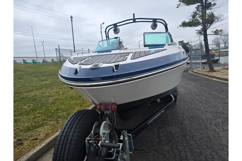 Slide: The Image of 2016 Chaparral Vortex 243 VRX boat on trailer, parked on a paved road. - 6