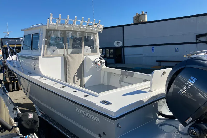 The Image of 2025 Steiger Craft 28 Chesapeake boat with Yamaha engine, docked outdoors. - 1