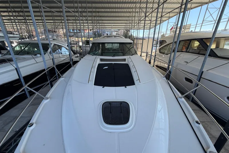 Slide: The Image of 2014 Sea Ray 540 Sundancer yacht docked in a covered marina. - 19