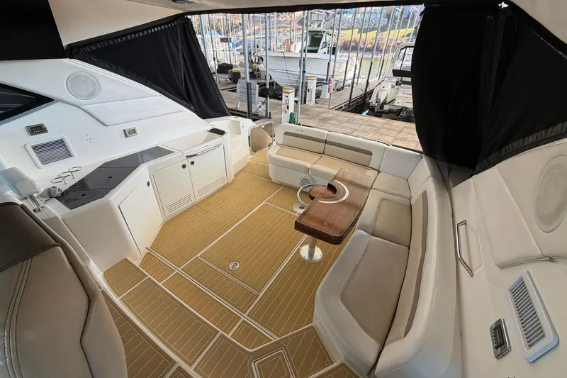 Slide: The Image of Luxurious interior of 2014 Sea Ray 540 Sundancer yacht with seating and table. - 22