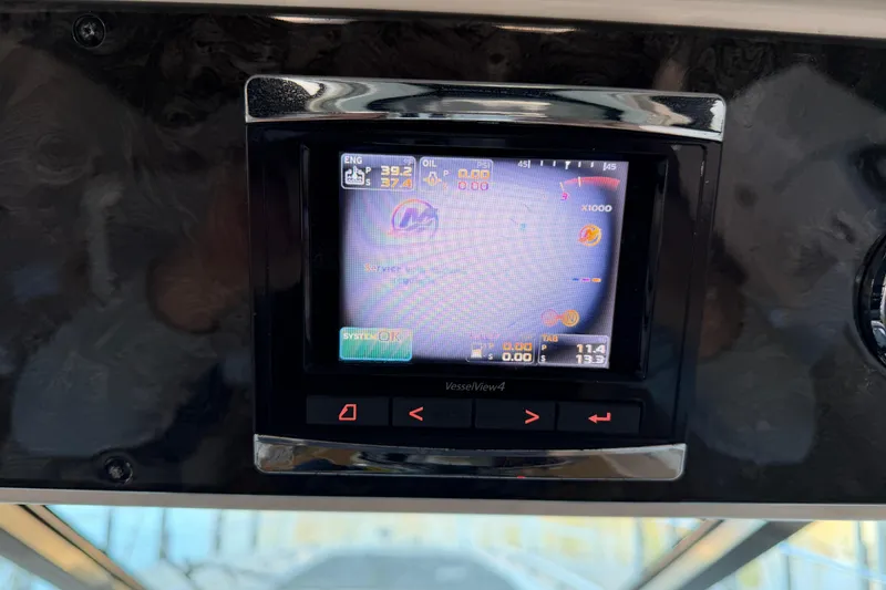 Slide: The Image of 2014 Sea Ray 540 Sundancer dashboard display showing VesselView4 engine data. - 28